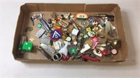 Assorted key chain items and pens, pocket knives,