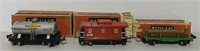Lionel oil tanker, caboose and lumber car