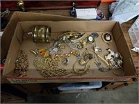 Box of costume jewelry with large bracelet