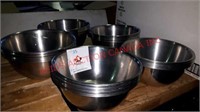 5 piles of stainless steel bowls