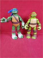 Two Teenage Mutant Ninja Turtle Action Figures