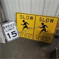 15 mile speed & 2 slow child playing signs