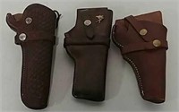 3 leather pistol holsters