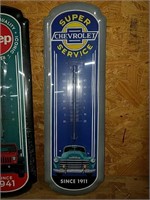 Tin Chevrolet wall hanging thermometer.