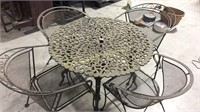 Cast iron table with metal chairs