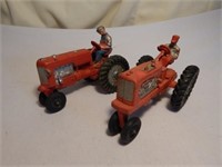 (2) Red Rubber Auburn Tractors