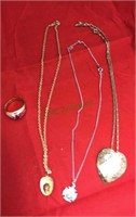 Three necklaces with pendants the fireman‘s hat