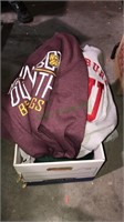 Box of new college sweatshirts and other shirts