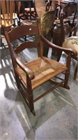 Clore fancy back walnut rocking chair with a rush