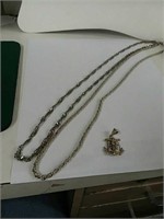 Two necklaces with one charm