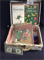 Vintage little suitcase with books and crayons ,