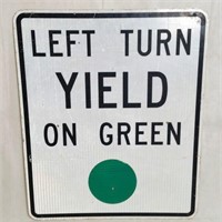 Left Turn Yield on Green Metal Road Sign