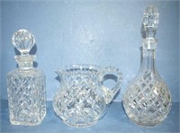 Two cut crystal decanters and a jug