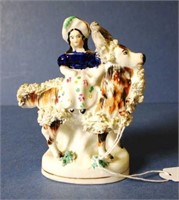 Antique Staffordshire woman with goat figure
