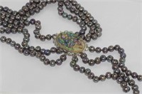 Boxed three strand pearl necklace with paua shell