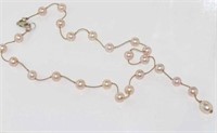 Delicate pink pearl necklace with pearl drop