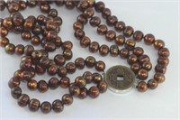 Bronze coloured pearls with oriental clasp