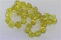 Matinee length green Baltic amber bead necklace