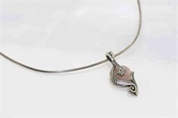 Silver necklace with a rose quartz pendant