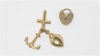 Gold heart lock and small charms all marked 375