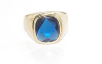 9ct yellow gold and facetted blue stone ring