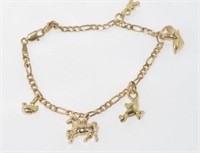 9ct yellow gold charm bracelet and 5 charms