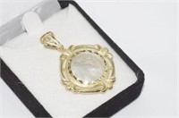 Mother of pearl engraved pendant set in 14ct gold