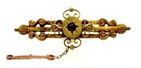 Vintage 15ct gold brooch with garnet