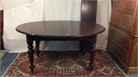 SOLID WALNUT OVAL DINING TABLE ON ORIGINAL CASTERS
