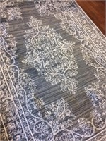 Home Accent Rug 5’ by 7’6”
