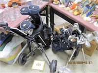 2 sets of golf clubs, bags, cart, balls, tees, &
