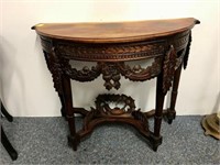 Heavily Carved demilune table