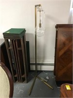 Modern floor lamp with clear hanging bulb