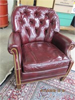 Maroon leather side chair, back leg been repaired