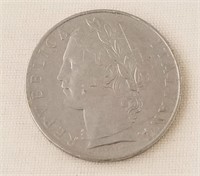 1957 L.100 Coin