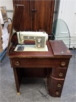 VTG SEWING MACHINE IN  AN ART DECO CABINET