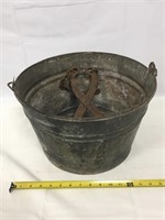 Antique bucket and ice tongs.
