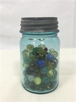 Mason jar full of marbles.