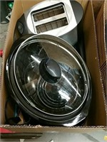 Box of slow cooker and toaster