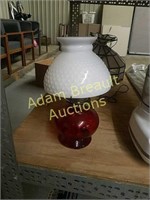 Vintage red oil lamp with milk glass globe