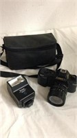 Canon camera with Vivitar flash and carrying case