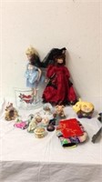 Group of collectible dolls and snow globes and