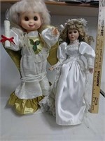 Two vintage collectible dolls. One is light up