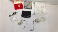 Assorted key chains and pocket rosaries with