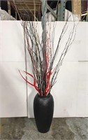 Black vase with painted stick decor