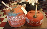 2 vintage red gasoline cans