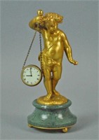 FRENCH GILT BRONZE SCULPTURE OF A PUTTO WITH CLOCK