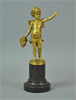 GERMAN GILT BRONZE SCULPTURE OF A CHILD WITH MASK