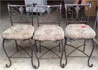 Three upholster metal bistro chairs