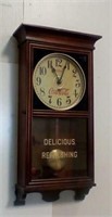 Battery operated Coca-Cola clock with pendulum